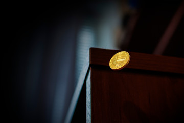coin falls off the table. concept: depreciation of the Russian ruble. Ruble exchange rate on international stock exchanges
