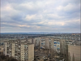 Thick, beautiful clouds above the high-rise buildings of the city.