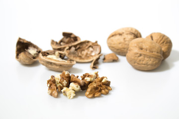 Broken walnuts isolated in a white background