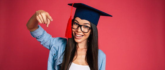 Study, education, university, college, graduate concept on banner. Happy and excited portrait of young student girl in hat of graduation isolated 