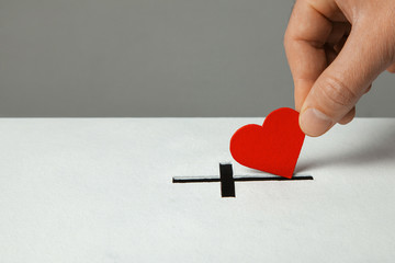 Donation of your heart as symbol of love for the religion of Christianity. Box for donations with...