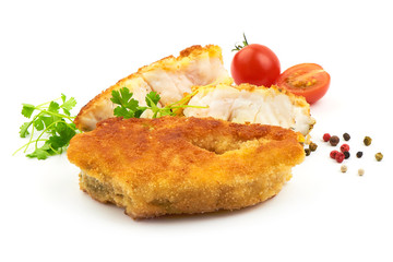 Golden Fried Fish Fillet with herbs, pepper and tomatoes, isolated on a white background. Close-up