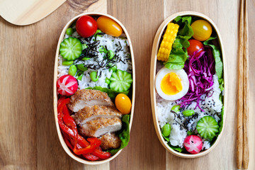 Japanese bento box with chicken, vegetables and rice