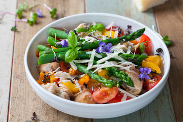 Italian panzanella bread and tomato salad with roast peppers, asparagus, parmesan and micro greens