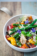 Italian panzanella bread and tomato salad with roast peppers, asparagus, parmesan and micro greens