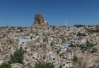 Obraz premium Uçhisar, Turkey - A Unesco World Heritage site, Cappadocia is famous for its fairy chimneys, churches and castles carved in the rock, and a unique heritage
