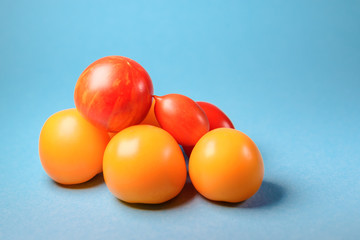 group of fresh yellow and red tomatoes
