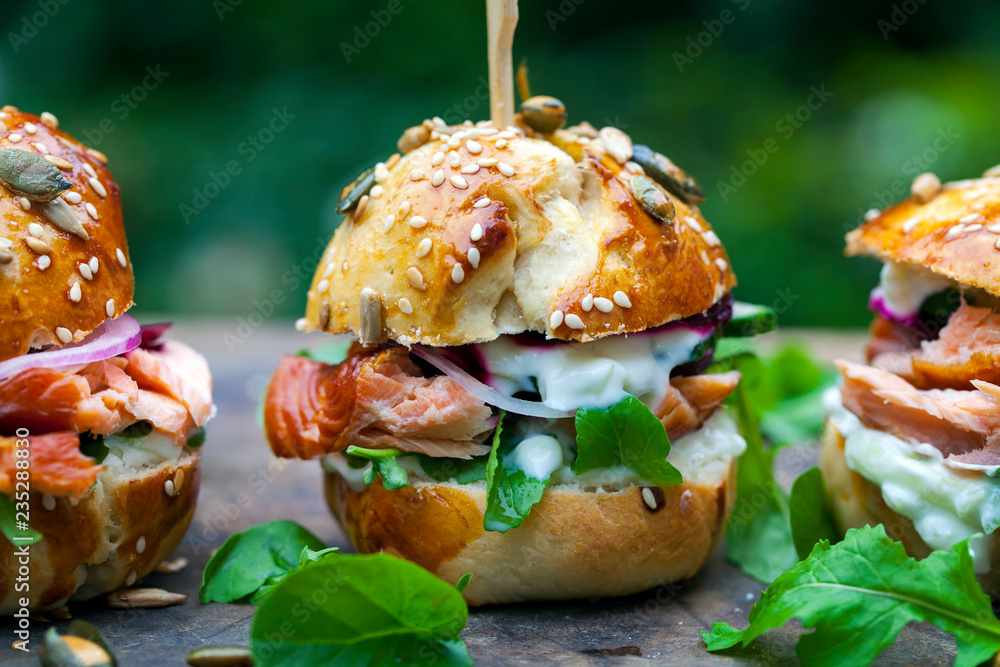 Wall mural brioche buns with hot smoked salmon, beetroot, salad and yogurt dressing