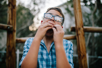 Portrait of a boy eating sandwich