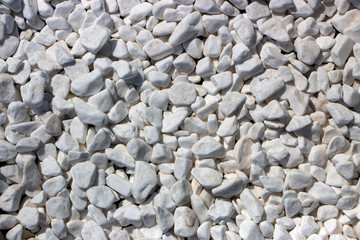 Marble crumb, natural mineral white background. Textured surface of decorative crushed stone.