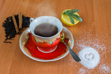 Cup of tea on a wooden background.