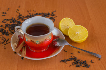 Cup of tea on a wooden background.