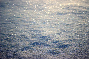 Winter background. Sparkling snow with bokeh.Winter landscape.
