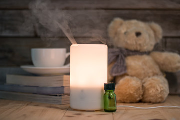 Ultrasonic humidifier on a wooden table, aroma maker in a home