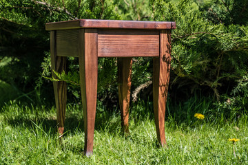Homemade wood stool against the backdrop of nature