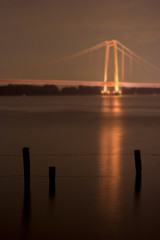 Barbed Wire Fence And Suspension Bridge