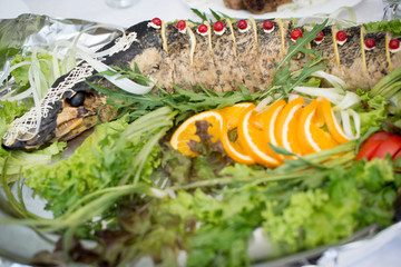 pike prepared fish and some salads behaind.