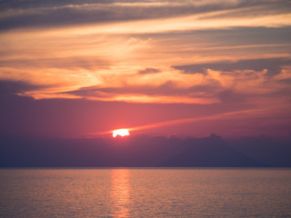 Naklejka na ściany i meble Wonderful sunset on the sea.