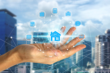 Hand holding with property investment icons