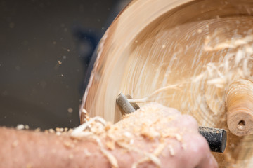 long spiral wood shavings while making a wooden bowl on turnery machine