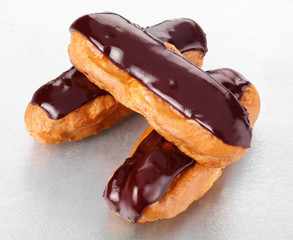 THREE CHOCOLATE ECLAIRS