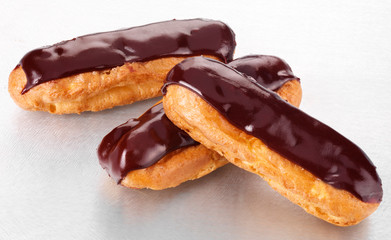 THREE CHOCOLATE ECLAIRS