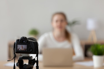Professional camera shooting online video course of female coach or speaker talking, woman film...