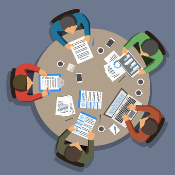 Group Of Business People Working At Round Office Table, Top View