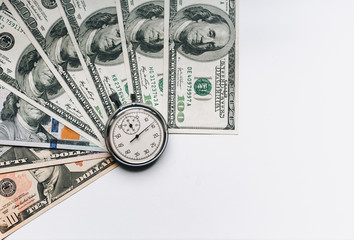 Stopwatch and dollars. Time is money concept. Banknotes and coins. Money loan. Credit debt. Copy space.
