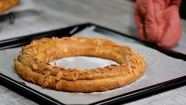 Freshly baked choux pastry cake. Making homemade choux pastry cake Paris Brest with raspberries.