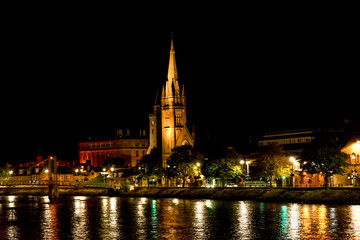 Fototapeta na wymiar A night view of city centre of Inverness with Free Church of Scotland