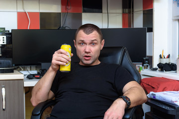 Serious fashionable man sitting alone in loft-styled cafe and talking with somebody