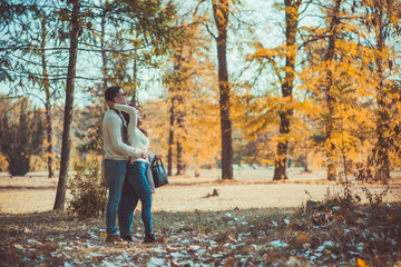 Fototapeta premium Two people in love admiring the view of the wood