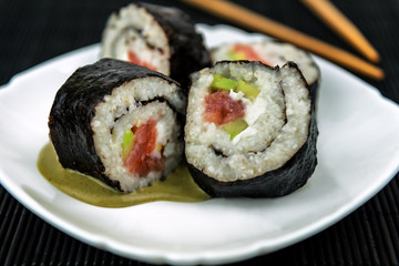 sushi rolls and wasabi