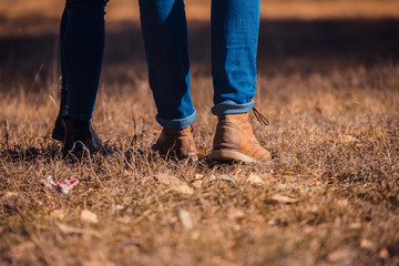 Couple in boots standing on the grass