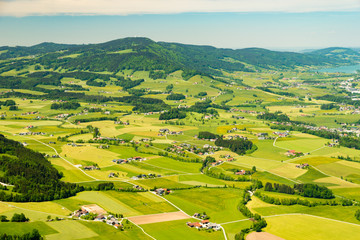 Aerial view on colorful small field parcels near Mondsee, Austria