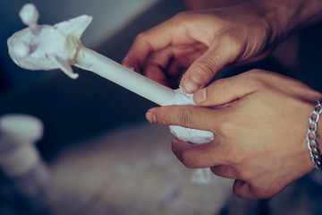 Students learn to make paper mache art as a giraffe in school.