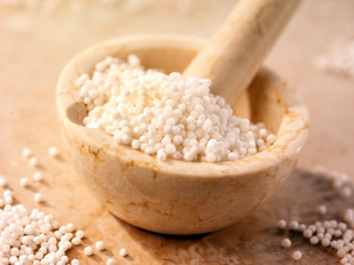 SAGO SEEDS IN PESTLE AND MORTAR