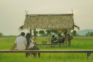 Asian people relax and take a photography on wooden bridge in th