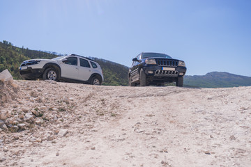 two off road vehicles in marble quarry
