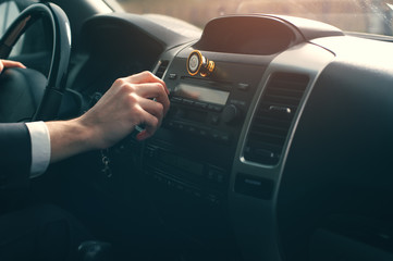 Close-up - Businessman at the wheel of new car