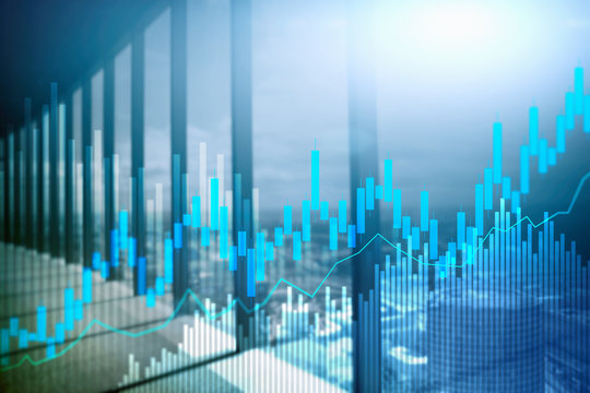 Stock Trading Candlestick Chart And Diagrams On Blurred Office Center Background.