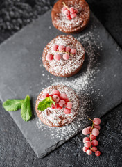 Classic chocolate fondant on a dark background. Chocolate muffins