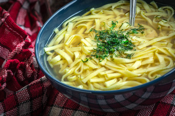 Broth - chicken soup in a bowl.