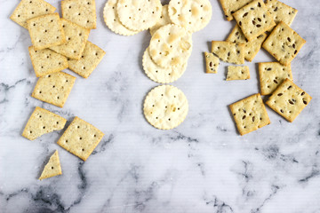 Matzo crackers, salty crackers with sesame seeds and flax seeds on a light background.