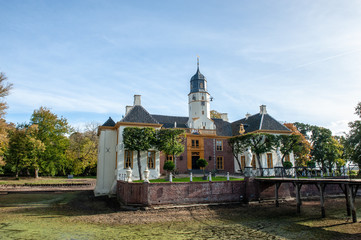 Fototapeta premium Exterior of a historic palace in the Dutch Province of Groningen, known as Fraeylemaborg. Impression from an early autumn afternoon.