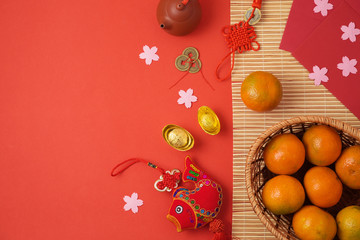 Chinese New Year background with traditional decorations for Spring festival on red table