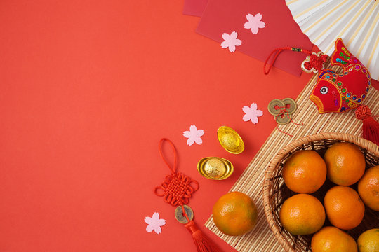 Chinese New Year Background With Traditional Decorations For Spring Festival On Red Table