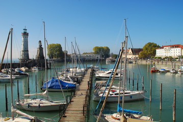 Harbour entrance of Lindau,  Lake Constance (German: Bodensee) with the new lighthouse and the Bavarian Lion