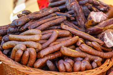 Smoked sausages and meat for sale on a shop.